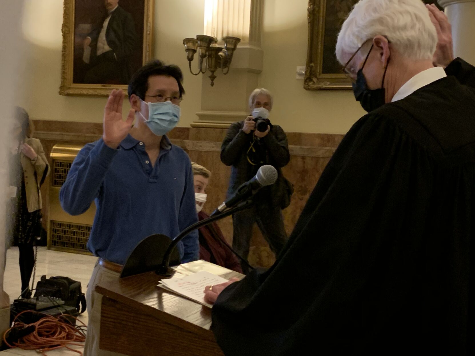 Alternate elector Roger Fang is sworn in by Chief Justice Nathan Coats